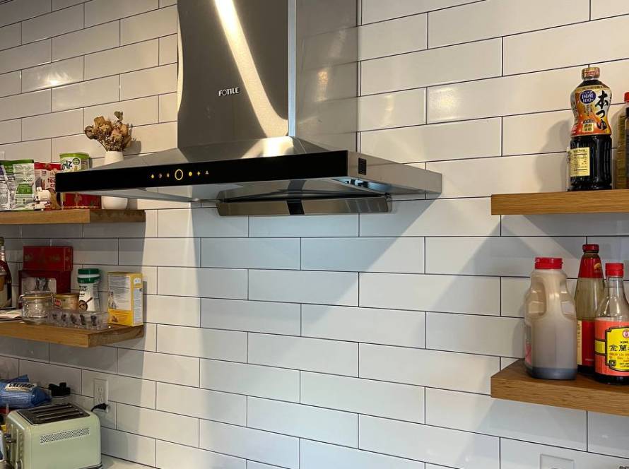 Modern kitchen with a Fotile range hood and gas stove